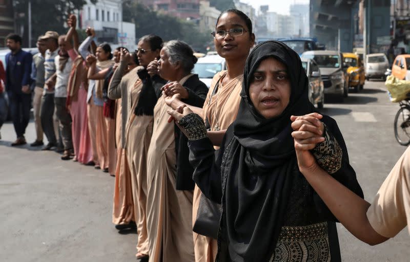 Demonstrators form a human chain after Republic Day celebrations to protest against a new citizenship law in Kolkata