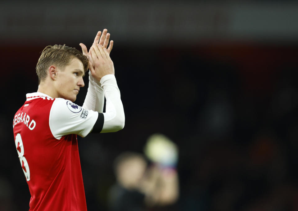 Arsenal's Martin Odegaard celebrates at the end of the English Premier League soccer match between Arsenal and West Ham United at Emirates stadium in London, Monday, Dec. 26, 2022. (AP Photo/David Cliff)
