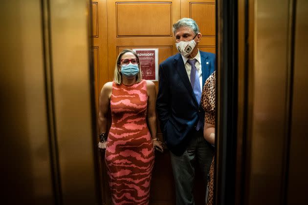 Sen. Kyrsten Sinema (D-Ariz.) and Sen. Joe Manchin (D-W.Va.) board an elevator on Capitol Hill, Sept. 30, 2021. (Photo: Jabin Botsford/The Washington Post via Getty Images)