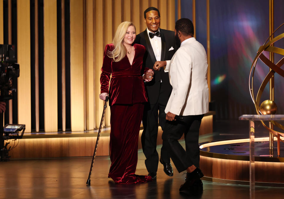 Christina Applegate, a guest and host Anthony Anderson speak onstage at the 75th Primetime Emmy Awards held at the Peacock Theater on January 15, 2024 in Los Angeles, California. / Credit: Christopher Polk/Variety via Getty Images