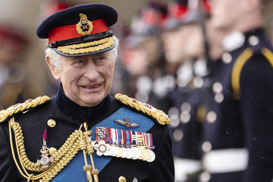 FILE - Britain's King Charles III inspects the 200th Royal Military Academy Sandhurst Sovereign's Parade and presents the new Colours and Sovereign's Banner to the receiving Ensigns in Camberley, England, Friday, April 14, 2023. King Charles III will be crowned Saturday, May 6, 2023 at Westminster Abbey in an event full of all the pageantry Britain can muster. (Dan Kitwood/Pool Photo via AP, File)