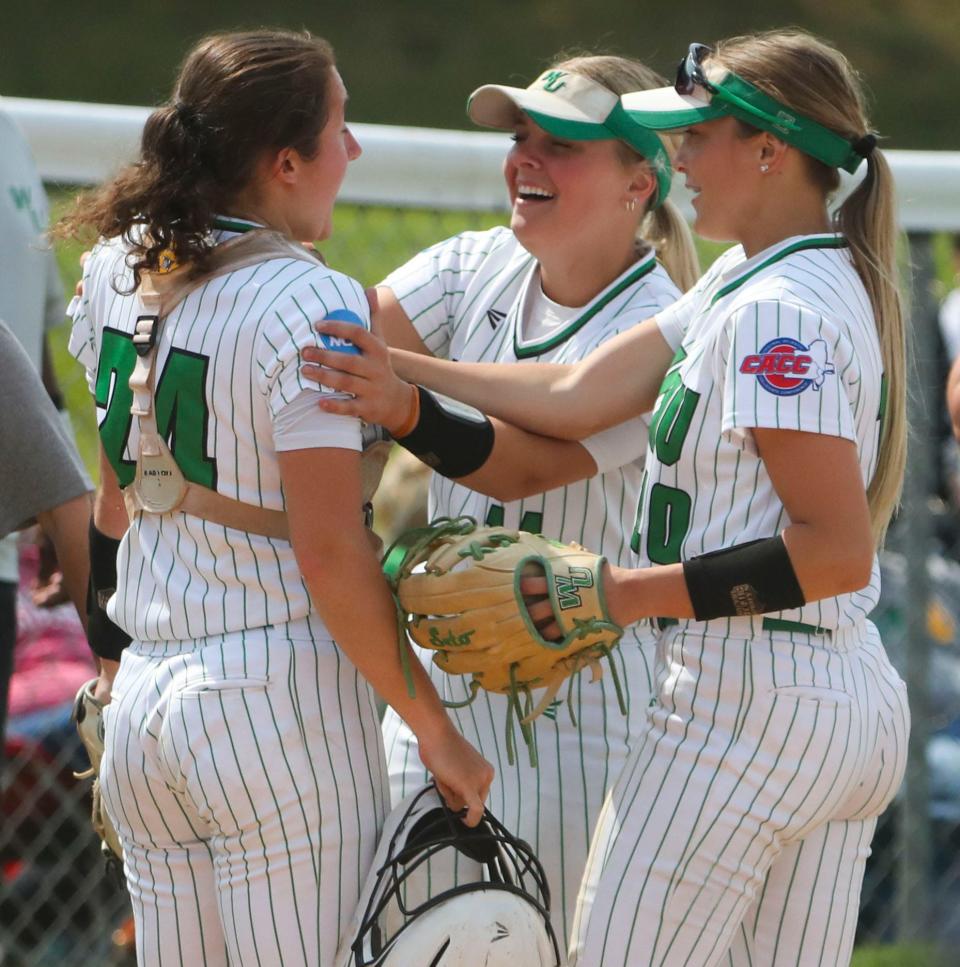 Wilmington starting pitcher Kylee Gunkel (center) and third baseman Sara Miller converge on catcher Emma Zimmerman after Zimmerman made a tag play to end the Wildcats' 2-1 win against Pace in their opening game of the NCAA Division II regional tournament at Wilmington University Thursday, May 11, 2023. The Wildcats meet Georgian Court in the winners bracket Friday at 10a.m. at Asbury Field.