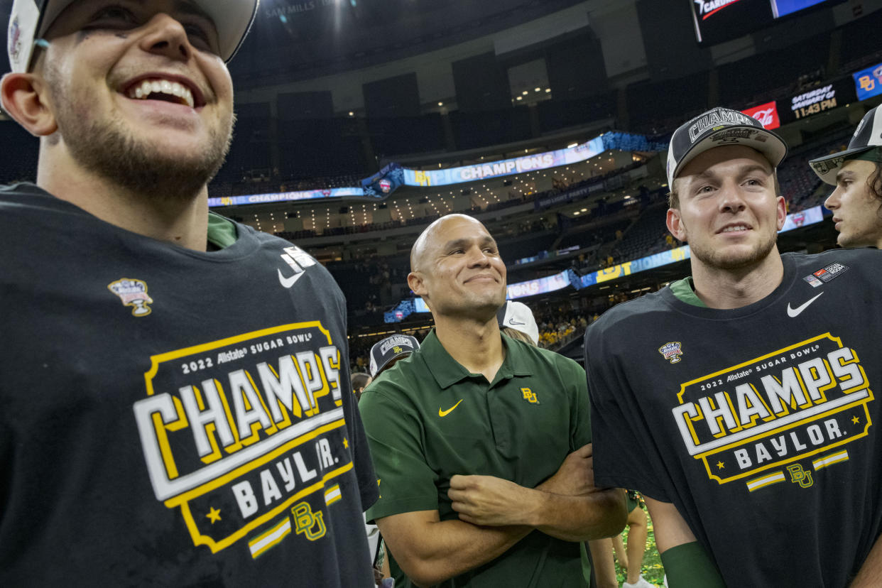 Baylor players celebrate with coach Dave Aranda after the Sugar Bowl NCAA college football game against Mississippi in New Orleans, Saturday, Jan. 1, 2022. Baylor won 21-7. (AP Photo/Matthew Hinton)