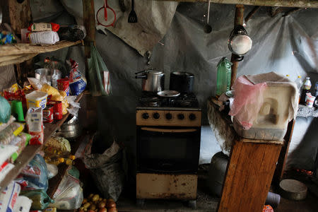 An improvised kitchen is seen at a miners' camp at an illegal gold mine during an operation conducted by agents of the Brazilian Institute for the Environment and Renewable Natural Resources, or Ibama, in national parks near Novo Progresso, southeast of Para state, Brazil, November 5, 2018. REUTERS/Ricardo Moraes