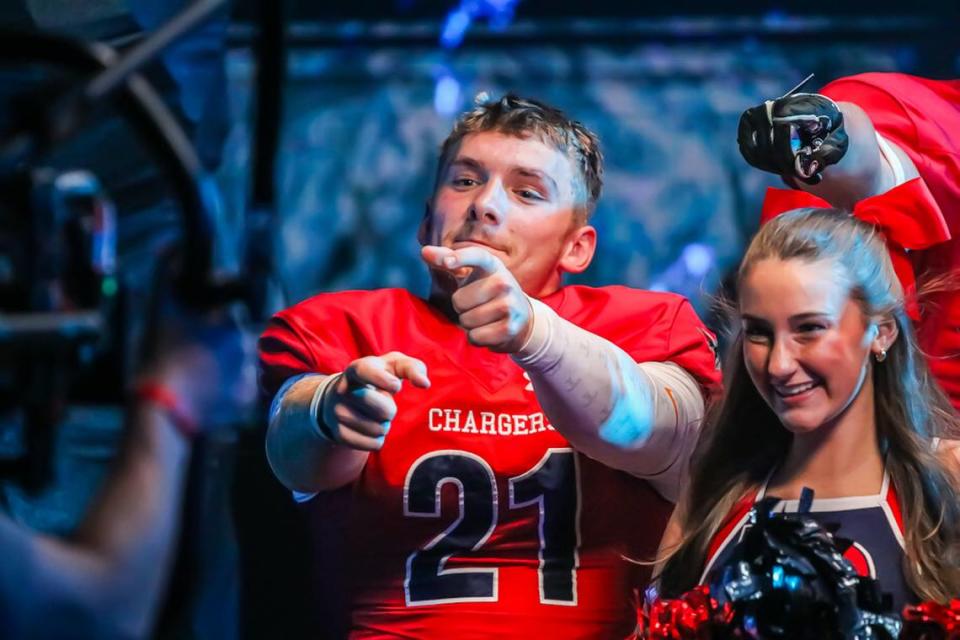 Providence Day’s Ian Cline at a photoshoot for a high school football doubleheader this fall. Four teams were invited to Bank of America Stadium Tuesday