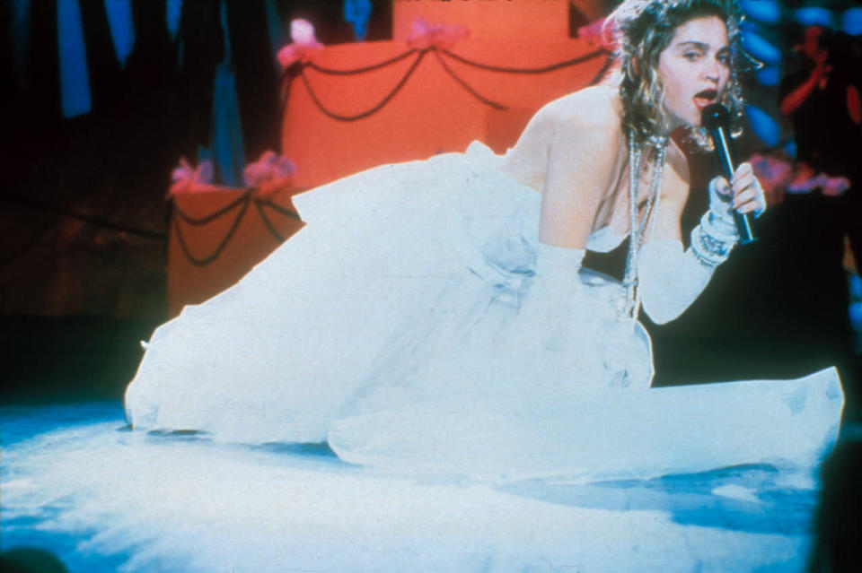 Madonna’s Opening Number: A Video Star Is Born (1984) - Older generations vividly recall the exact moment when they first saw Elvis twitch his pelvis on TV or when the Beatles first performed on Ed Sullivan. But for children of the ‘80s, one of the most defining televised music moments was when Madonna kicked off the inaugural VMAs. And it wasn’t even planned. “I lost  and I thought, 'Oh my God, how am I going to get that? It’s over there and I’m on TV.’ So I thought, 'Well, I’ll pretend I meant to do this,’ and I dove onto the floor. And I rolled around and I reached for the shoe, and as I reached for the shoe, the dress went up, and then the underpants were showing. And I didn’t mean to,” Madonna told Jay Leno years later. And thus, VMAs history was made. (Source: Getty Images)