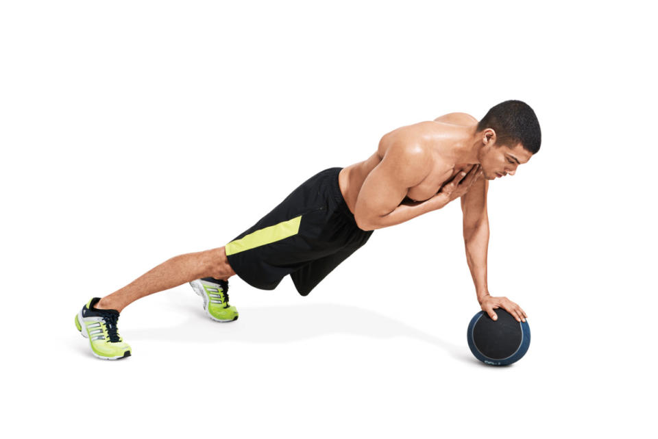 How to do it:<ol><li>Get into a pushup position resting your right hand on the medicine ball and left hand on the floor.</li><li>Lower your body until your chest is just above the floor, then push back up.</li></ol>