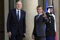 French President Emmanuel Macron, right, welcomes Lebanese Prime Minister Najib Mikati prior to their meeting at the Elysee Palace, in Paris, Friday, Sept. 24, 2021. (AP Photo/Francois Mori)