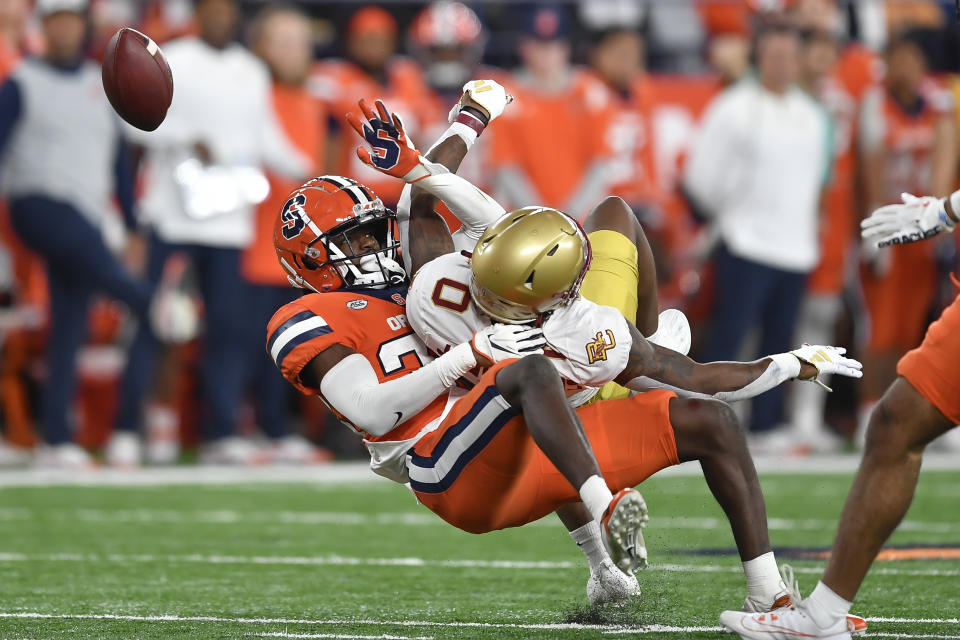 Syracuse defensive back Gregory Delaine, left, breaks up a pass intended for Boston College wide receiver Jaden Williams during the second half of an NCAA college football game in Syracuse, N.Y., Friday, Nov. 3, 2023. (AP Photo/Adrian Kraus)