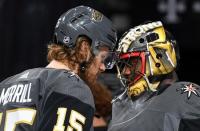 Apr 1, 2019; Las Vegas, NV, USA; Vegas Golden Knights goaltender Malcolm Subban (30) celebrates with defenseman Jon Merrill (15) after defeating the Edmonton Oilers at T-Mobile Arena. Mandatory Credit: Stephen R. Sylvanie-USA TODAY Sports