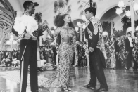 <p>Vanessa Bell Calloway's entrance at the beginning of <em>Coming to America</em> as the intended wife in the arranged marriage with Eddie Murphy's character is unforgettable. Partly due to her downright regal evening gown made of black sheer paneling and gold embroidered lace.</p>