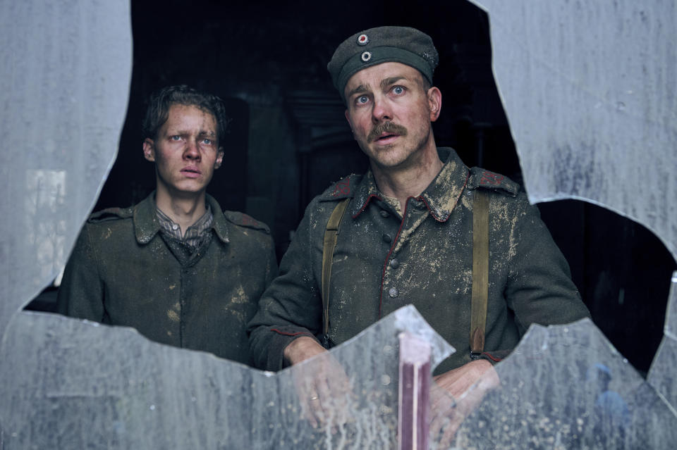 This image released by Netflix shows Felix Kammerer, left, and Albrecht Schuch in "All Quiet on the Western Front." (Reiner Bajo/Netflix via AP)