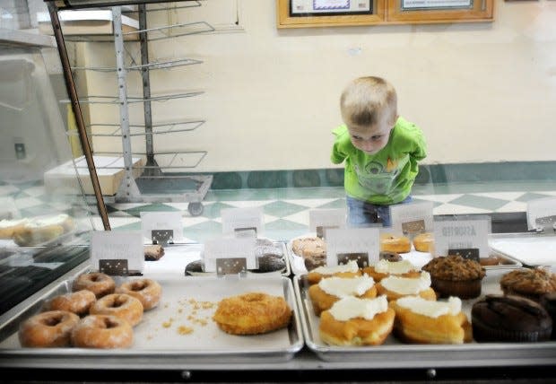 In this Times file photo, Logan Long of White Township gazes at the donuts through the glass at Oram's Donuts in Beaver Falls. He was there with his dad, Chad Long.
