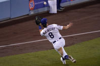 Los Angeles Dodgers second baseman Zach McKinstry makes a catch on a ball hit by Washington Nationals' Starlin Castro during the sixth inning of a baseball game Saturday, April 10, 2021, in Los Angeles. (AP Photo/Mark J. Terrill)