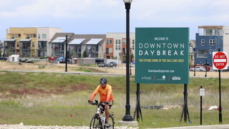 A cyclist bikes past the site of the future Salt Lake Bees ballpark in South Jordan on Friday, June 2, 2023.