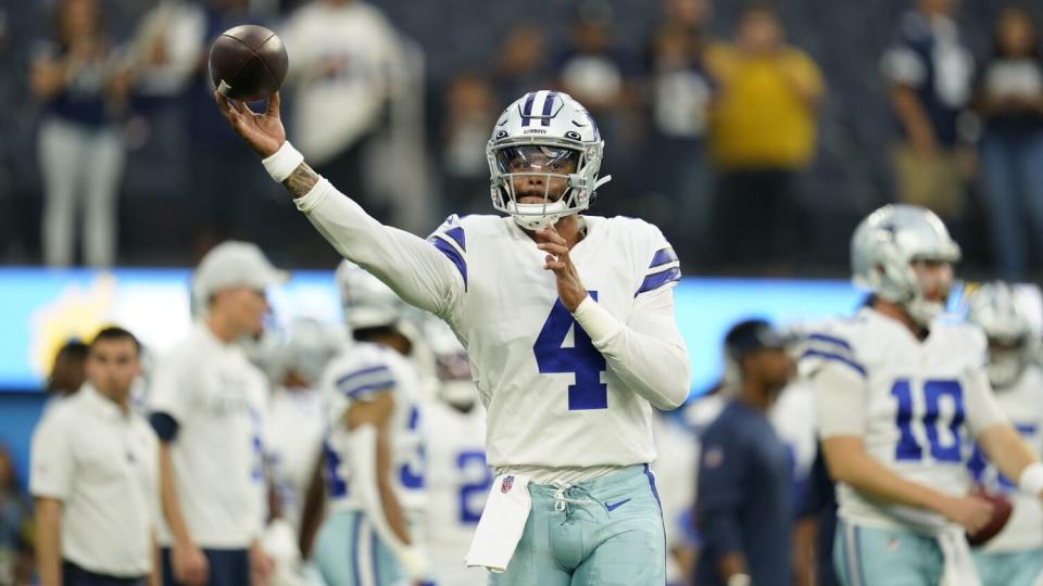 Dallas Cowboys quarterback Dak Prescott warms up before a preseason game.