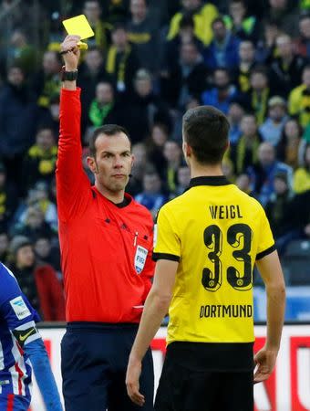 Football Soccer - Hertha Berlin v Borussia Dortmund - German Bundesliga - Olympiastadion, Berlin, Germany - 06/02/16 Borussia Dortmund's Julian Weigl is shown yellow card REUTERS/Fabrizio Bensch