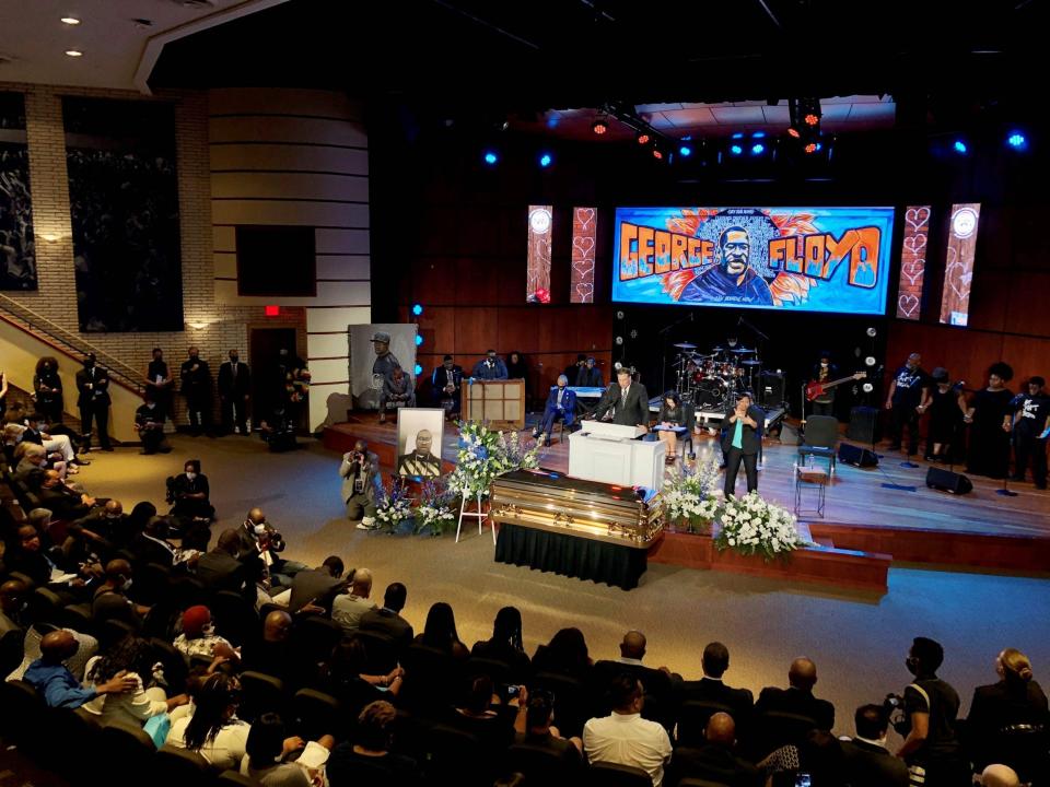 Artwork was projected behind the casket (AFP via Getty Images)