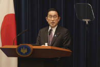 Japanese Prime Minister Fumio Kishida speaks during a news conference in Tokyo, Wednesday, March 16, 2022. Kishida on Wednesday announced plans to fully lift coronavirus restrictions on March 21 as new infections driven by the highly contagious omicron variant slow. (Stanislav Kogiku/Pool Photo via AP)