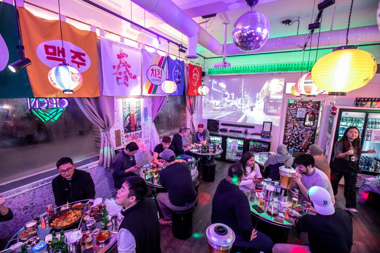 Noori Pocha aims to recreate the essence of the Korean pocha, where neon lights illuminate tables and crammed spaces foster conversation among strangers.