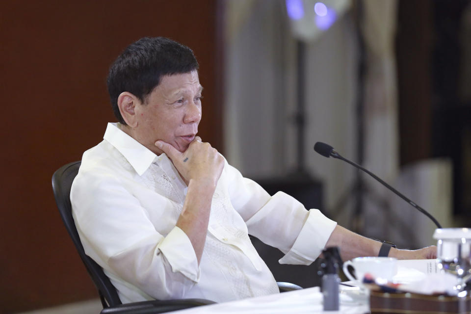 In this photo provided by the Malacanang Presidential Photographers Division, Philippine President Rodrigo Duterte gestures during a meeting with government officials at the Malacanang presidential palace in Manila, Philippines on Monday May 23, 2022. Outgoing Philippine President Duterte sharply criticized Russian leader Vladimir Putin for the killings of innocent civilians in Ukraine, saying while the two of them have been tagged as killers, “I kill criminals, I don’t kill children and the elderly.” (Valerie Escalera/Malacanang Presidential Photographers Division via AP)