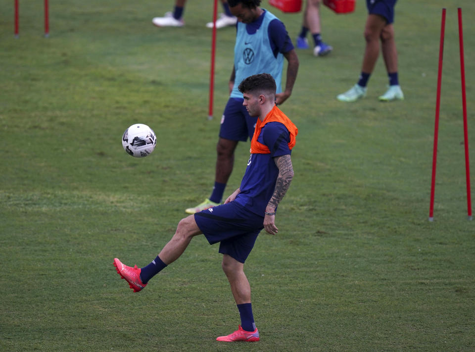 United States' Christian Pulisic controls a ball during a training session ahead of the World Cup 2022 qualifying soccer match against Jamaica in Kingston, Monday, Nov. 15, 2021.(AP Photo/Fernando Llano)