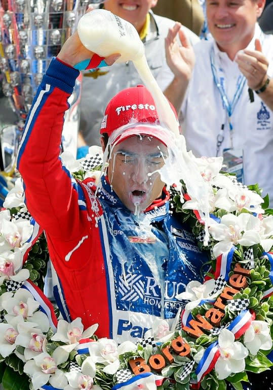 Takuma Sato of Japan celebrates in Victory Lane after winning the 101st running of the Indianapolis 500