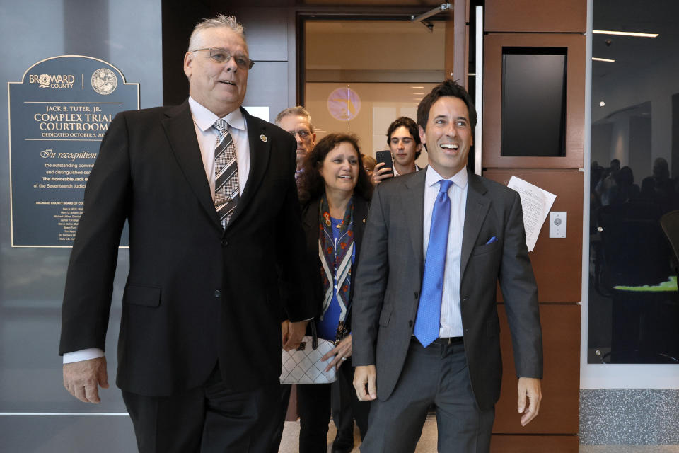 Former Marjory Stoneman Douglas High School School Resource Officer Scot Peterson leaves the courtroom after he was found not guilty on all charges at the Broward County Courthouse in Fort Lauderdale, Fla., on Thursday, June 29, 2023. Defense attorney Mark Eiglarsh is at right. Peterson was acquitted of child neglect and other charges for failing to act during the Parkland school massacre, where 14 students and three staff members were murdered. (Amy Beth Bennett/South Florida Sun-Sentinel via AP, Pool)