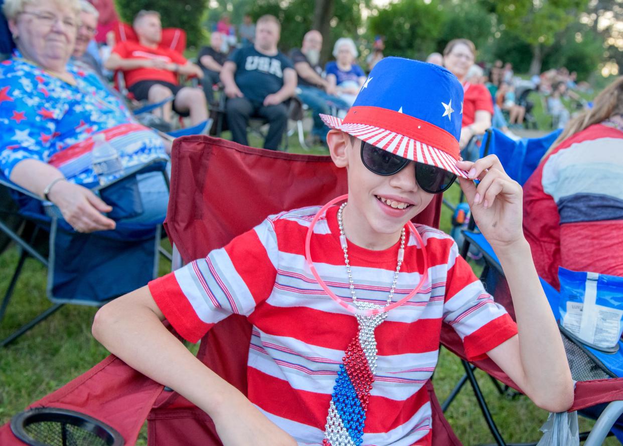 Benito Menchaca Jr., 13, of Pekin, sports a stylish patriotic outfit during the annual 3rd of July Fireworks Celebration on Monday, July 3, 2023 at Glen Oak Park in Peoria.