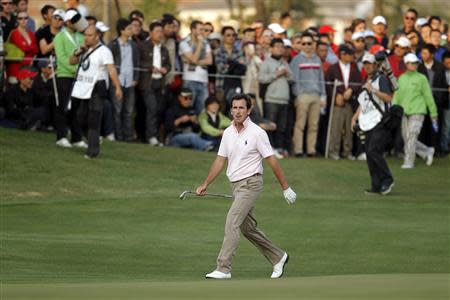 Gonzalo Fernandez-Castano of Spain walks to the 18th hole during the BMW Masters 2013 golf tournament at Lake Malaren Golf Club in Shanghai, October 27, 2013. REUTERS/Carlos Barria