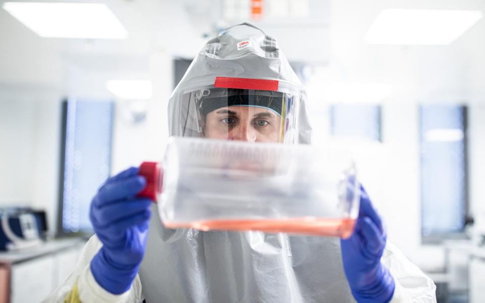 Growth media for virus production is examined in the Valneva laboratories - Akos Stiller 