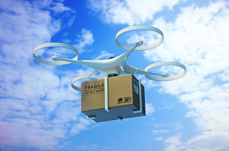 Drones carry express packages in the sky."nPackages are transported in high-tech Settings,online shopping,Concept of automatic logistics management.3d rendering.