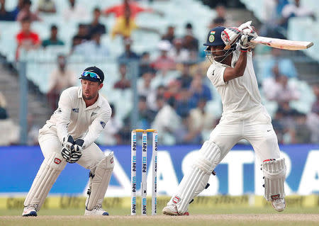 Cricket - India v New Zealand - Second Test cricket match - Eden Gardens, Kolkata, India - 02/10/2016. India's Wriddhiman Saha plays a shot. REUTERS/Rupak De Chowdhuri