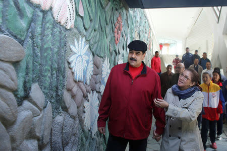 Venezuela's President Nicolas Maduro (L) and his wife Cilia Flores (R) inspect the rebuilding of the Humboldt Hotel, a state-run hotel, at the Avila mountain in Caracas, Venezuela December 7, 2017. Miraflores Palace/Handout via REUTERS