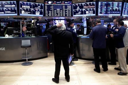 Traders work on the floor of the New York Stock Exchange (NYSE) in New York City, U.S., December 16, 2016. REUTERS/Brendan McDermid