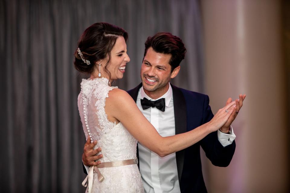 a bride and groom dancing at the wedding