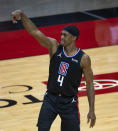 Los Angeles Clippers guard Rajon Rondo (4) watches a shot during the first quarter of an NBA game against the Houston Rockets on Friday, May 14, 2021, in Houston. (Mark Mulligan/Houston Chronicle via AP)