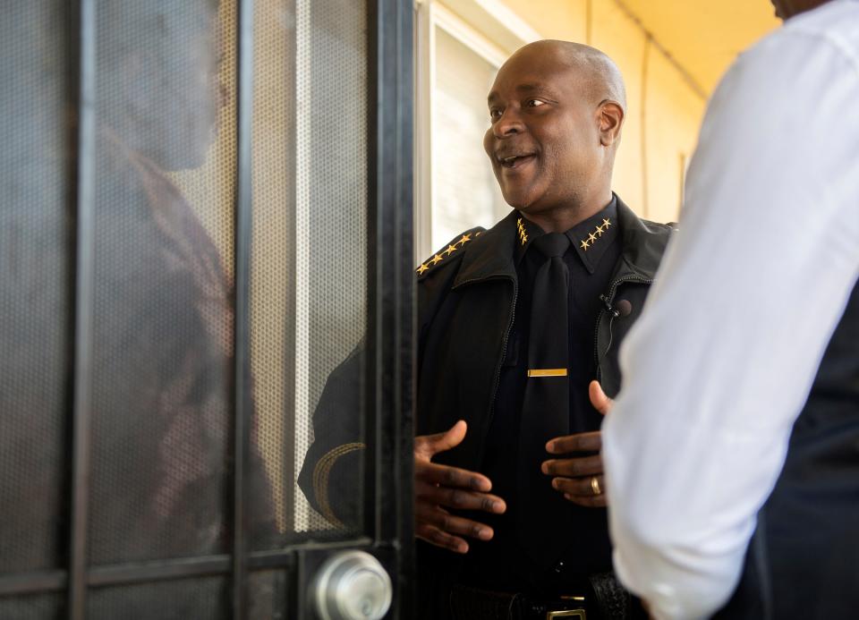 Stockton Police Chief Stanley McFadden talks with a resident during a neighborhood walk through in the Sierra Vista area of south Stockton. In March, the area experienced 2 double murders.