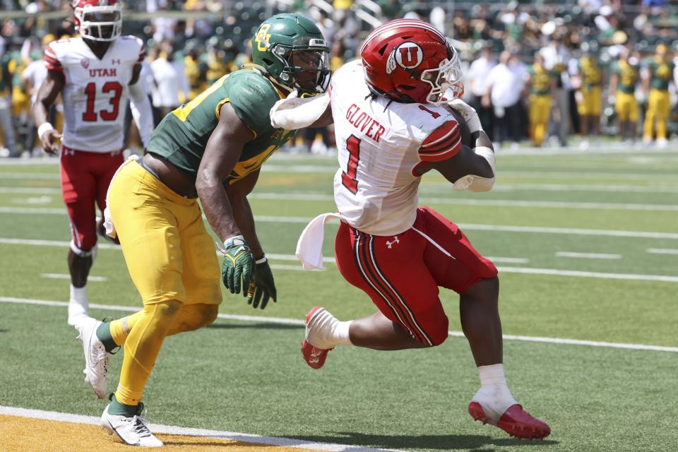 Utah running back Jaylon Glover scores a touchdown past Baylor linebacker Brooks Miller in the second half of an NCAA college football game, Saturday, Sept. 9, 2023, in Waco, Texas. (AP Photo/Jerry Larson) | AP