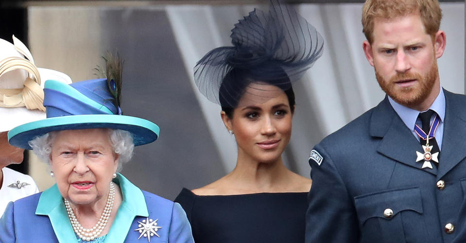 Queen Elizabeth II, Prince Harry, Duke of Sussex and Meghan, Duchess of Sussex on the balcony of Buckingham Palace as the Royal family attend events to mark the Centenary of the RAF on July 10, 2018 in London, England. (Photo by Chris Jackson/Getty Images)