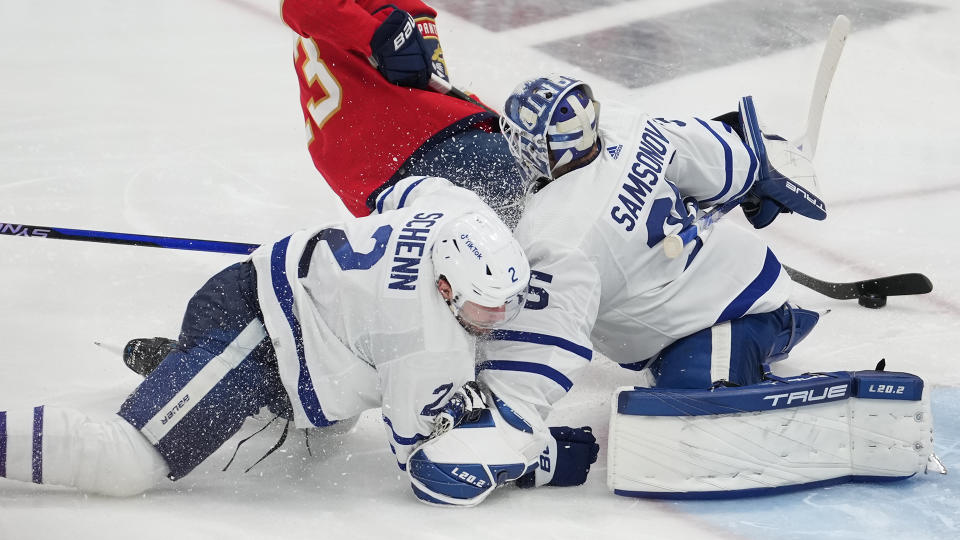 Toronto Maple Leafs defenseman Luke Schenn (2) slides hard into Toronto Maple Leafs goaltender Ilya Samsonov (35) knocking him out of the game. (Photo by Peter Joneleit/Icon Sportswire via Getty Images)