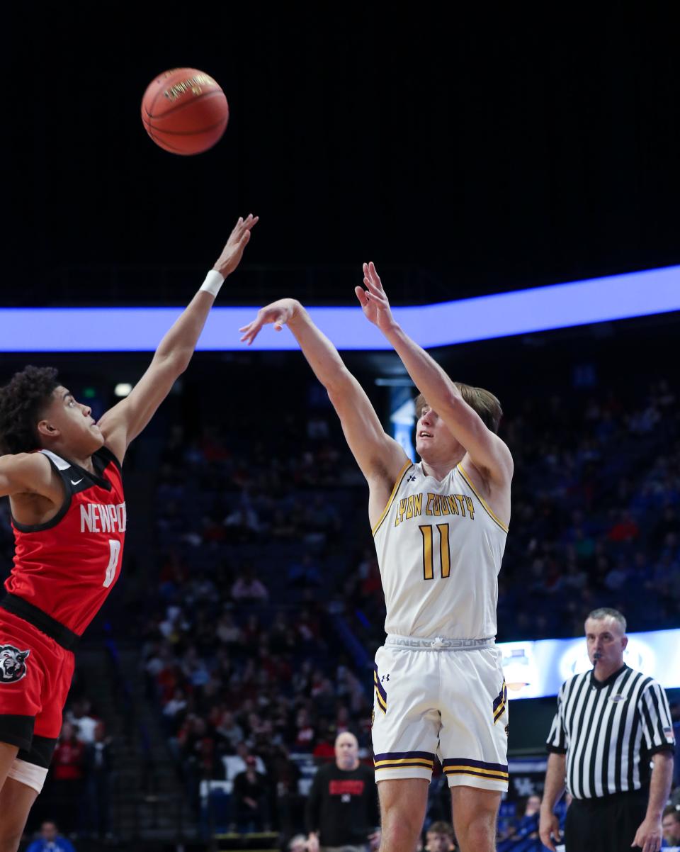 Lyon County’s Travis Perry (11) fires up a jumper against Newport’s Taylen Kinney (0) for a loose ball during the Sweet 16 tournament at Rupp Arena in Lexington, Ky. on Mar. 16, 2023.  