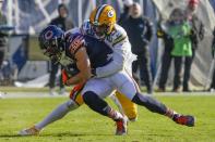 Chicago Bears' Chase Claypool fumbles as he is hit by Green Bay Packers' Rasul Douglas during the first half of an NFL football game Sunday, Dec. 4, 2022, in Chicago. (AP Photo/Nam Y. Huh)