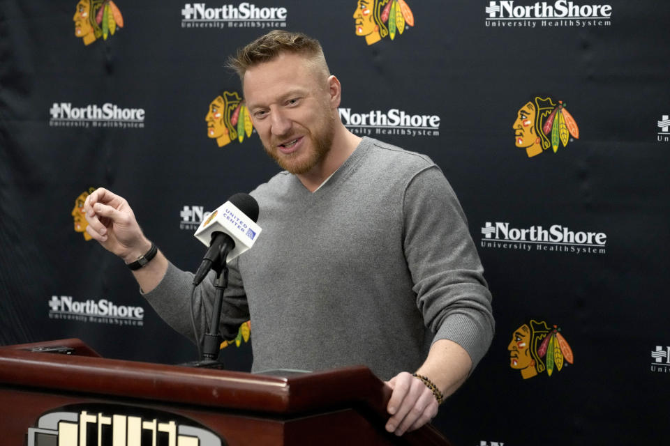 Former Chicago Blackhawks great Marian Hossa responds to a reporter's question before an NHL hockey game between the Blackhawks and the St. Louis Blues on Wednesday, Nov. 16, 2022, in Chicago. The Blackhawks are planning to retire Hossa's No. 81 sweater before Sunday's game against the Pittsburgh Penguins. (AP Photo/Charles Rex Arbogast)