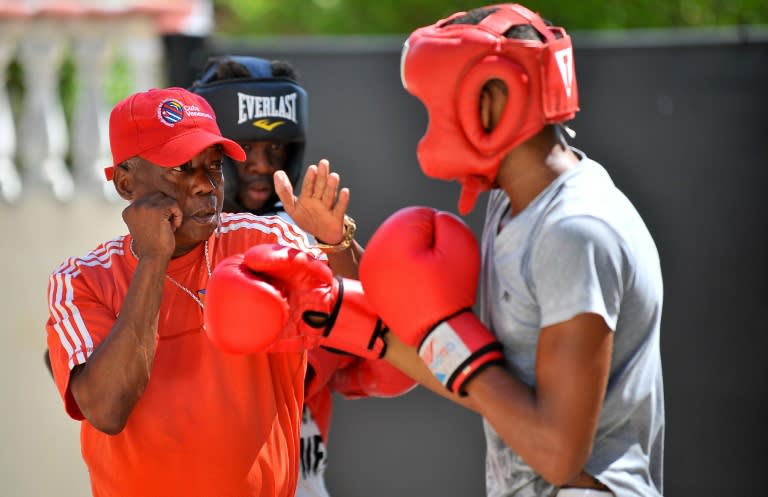 When he was a Cuban boxing champion in the 1970s, Jorge Hernandez (L) fought for knockouts -- or at least for stoppages in his favor, he says