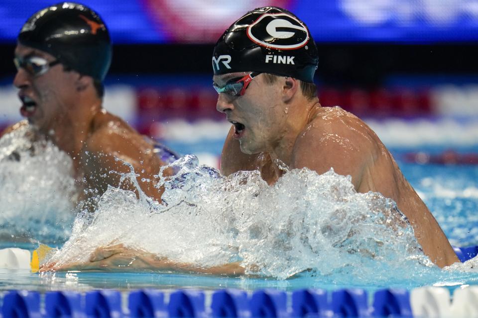 Nic Fink participates in the men's 200 breaststroke during wave 2 of the U.S. Olympic Swim Trials on Thursday, June 17, 2021, in Omaha, Neb. (AP Photo/Jeff Roberson)