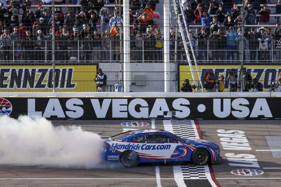 Kyle Larson (5) celebrates after winning a NASCAR Cup Series auto race at Las Vegas Motor Speedway Sunday, March 3, 2024, in Las Vegas. (AP Photo/Ian Maule)