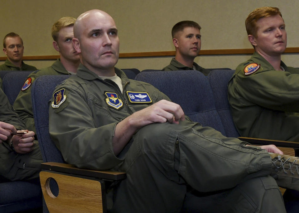 In this Oct. 13, 2016, photo provided by the U.S. Air Force, Air Force Col. Todd Hohn, foreground, and pilots assigned to the 97th Air Mobility Wing are briefed on an exercise at Altus Air Force Base, Okla. Hohn, now a pilot for FedEx, was detained in Guangzhou, China, on Sept. 12, 2019, before boarding a commercial flight. The company said Thursday, Sept. 19, that he was later released, and it's working with Chinese authorities to understand what happened. (Airman 1st Class Kirby Turbak/U.S. Air Force via AP)