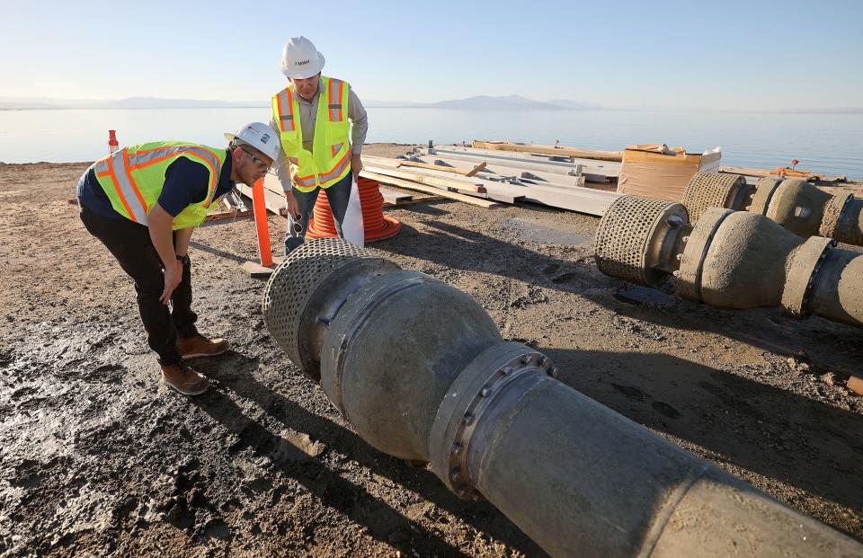 Dakota Ball, MWH Constructors Inc. manager, and Vivien L. Maisonneuve, program manager at the California Department of Water Resources’ Salton Sea Management Program, inspect pipes that are used to pump water from the Salton Sea into ponds for the Species Conservation Habitat Project in Imperial County, Calif., on Wednesday, Dec. 13, 2023. The water will be mixed with water from the New River, enabling control over salinity concentrations in the habitat’s ponds. | Kristin Murphy, Deseret News