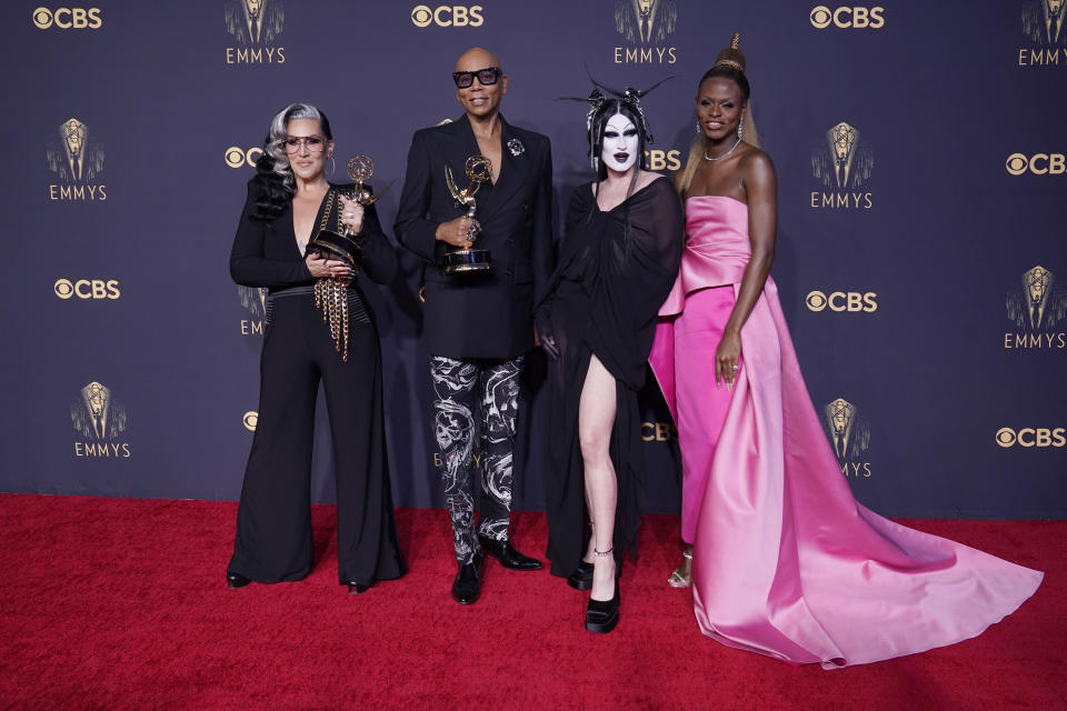 Michelle Visage, from left, RuPaul Charles, Gottmik, and Symone pose for a photo with the award for outstanding competition program for "RuPaul's Drag Race" at the 73rd Primetime Emmy Awards on Sunday, Sept. 19, 2021, at L.A. Live in Los Angeles. (AP Photo/Chris Pizzello)